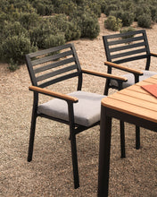 Load image into Gallery viewer, Bona stackable outdoor chair in aluminium with black finish and solid teak wood armrests - image 11