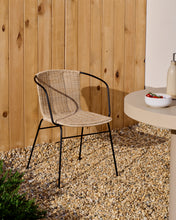 Load image into Gallery viewer, Eltiera stackable chair in synthetic rattan with black steel frame and armrests - image 12