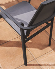 Load image into Gallery viewer, Canea stackable outdoor chair in grey texteline and graphite aluminium - image 7